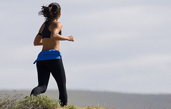 jogging woman in grass