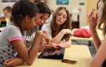 Girls using iPad to learn